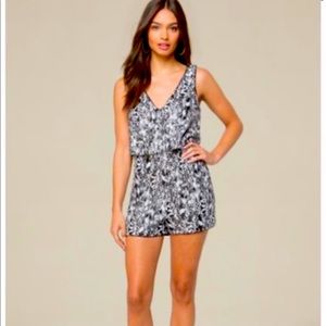 Bebe Sequin V Neck Romper with Back Mesh